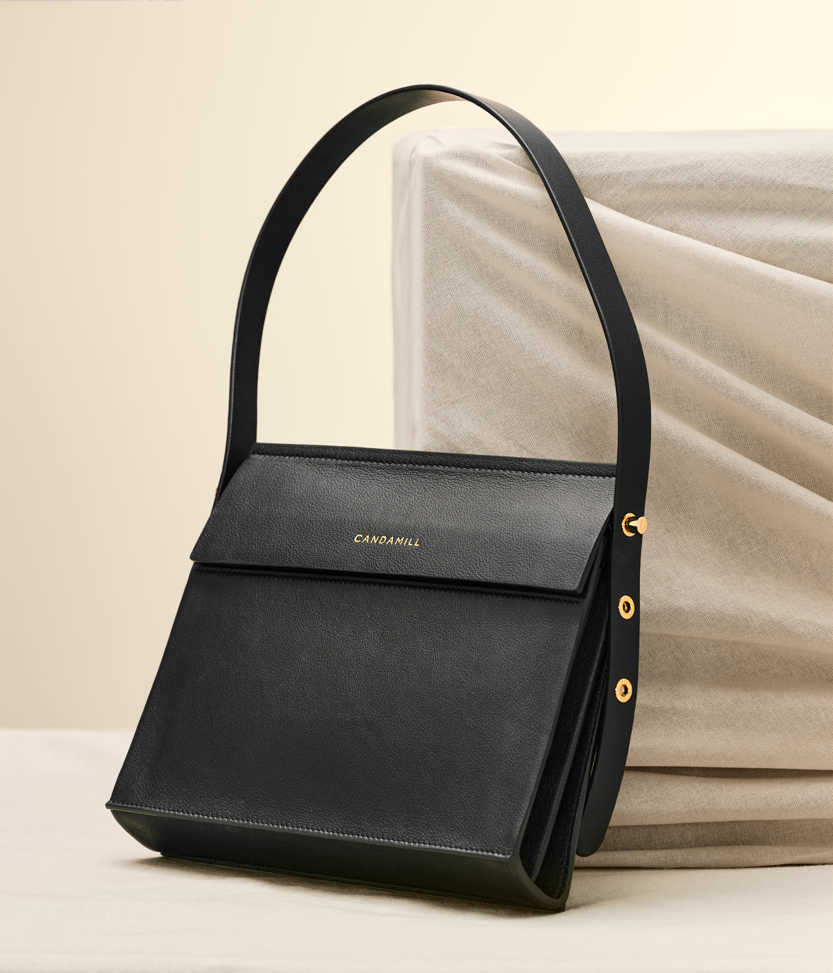 Low Rise shoulder bag in Black leather, front view with adjustable strap